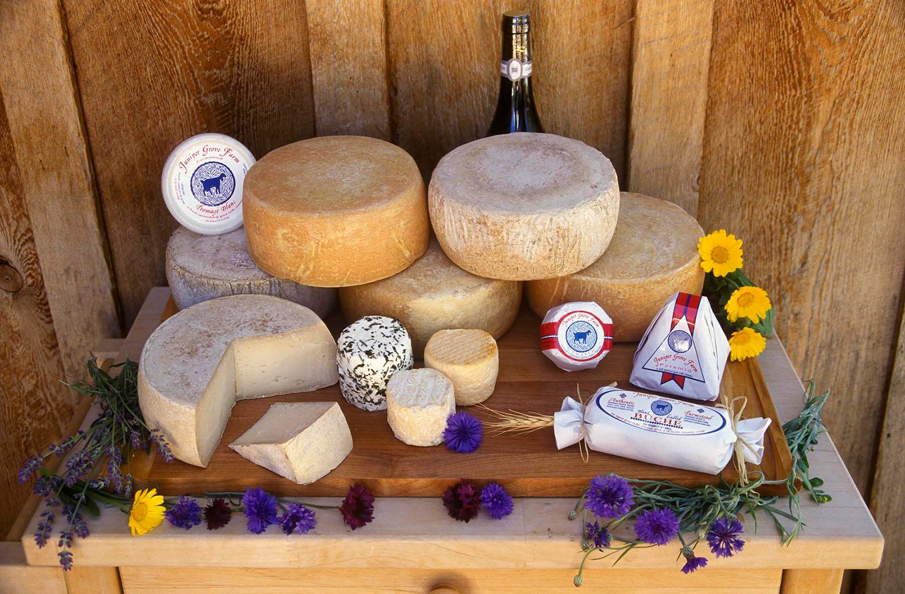 A display of the hand made GOAT CHEESES produced at JUNIPER GROVE FARM in REDMOND OREGON. - Photography by Craig Lovell