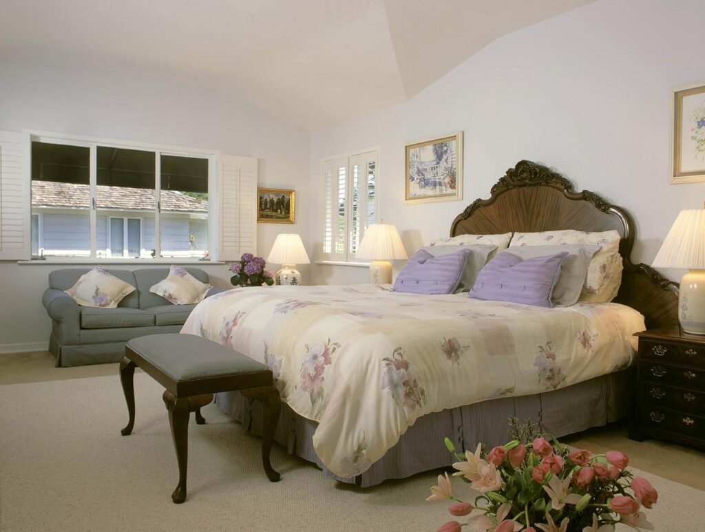 SANDPIPER INN GUEST ROOM with charming floral upholstery in CARMEL CALIFORNIA.- Architecture photography by Eagle Visions Photography