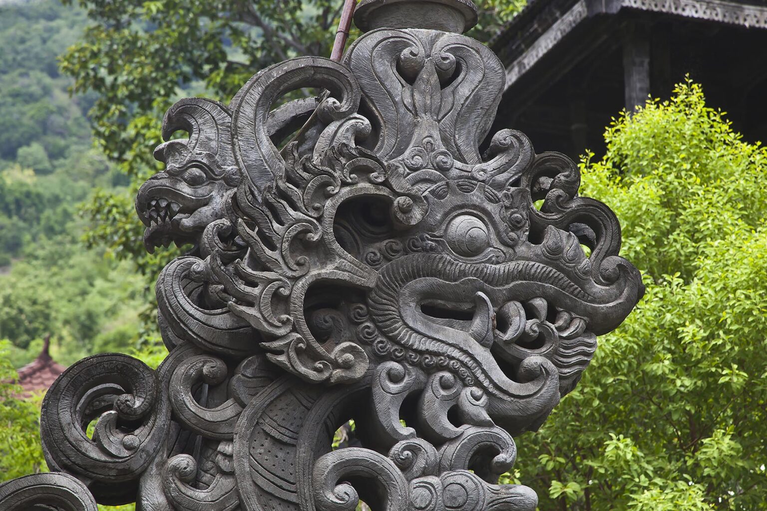 Stone carved dragon at PURA MELANTING a Hindu temple located in a beautiful agriculture valley near PEMUTERAN - BALI, INDONESIA