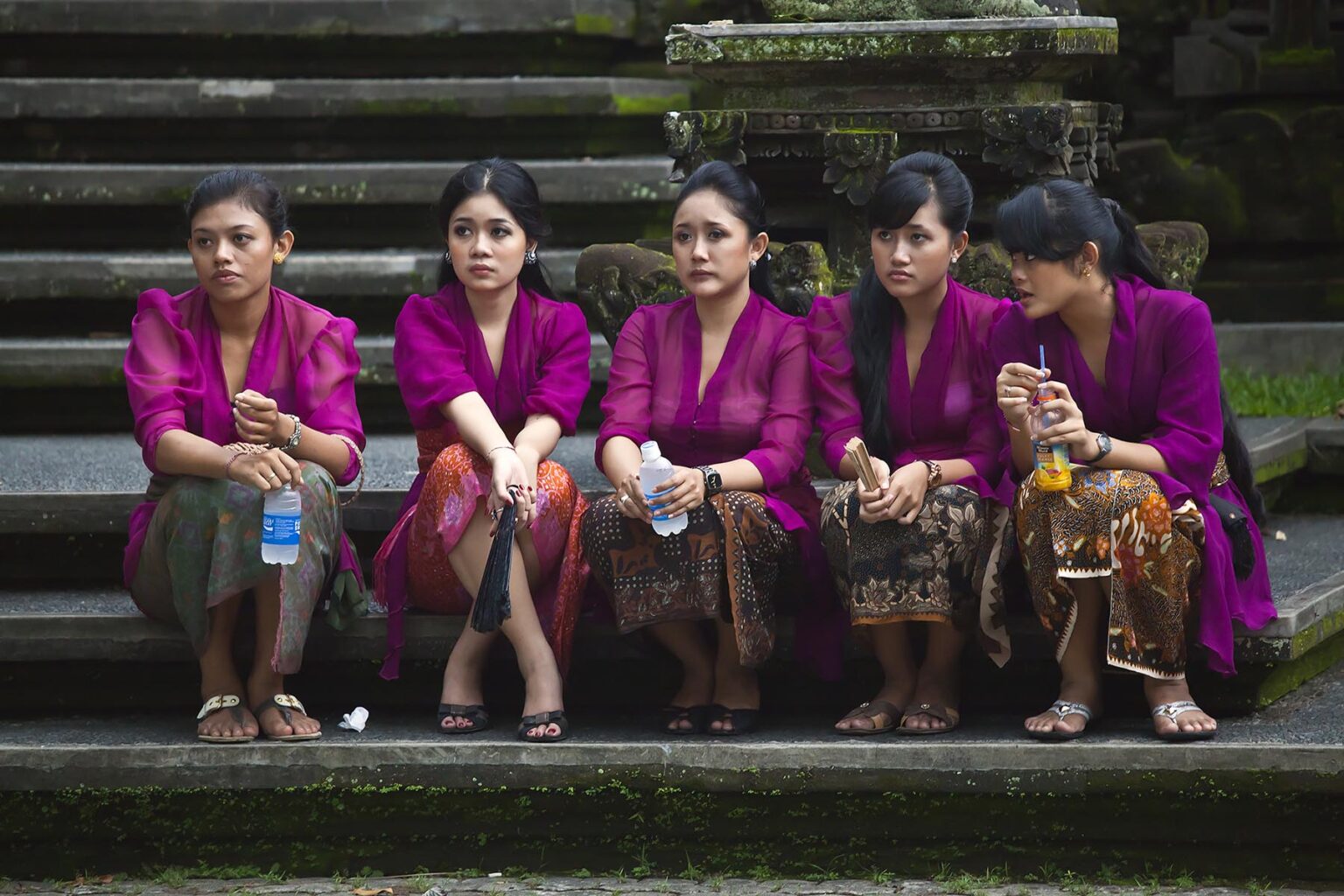 Relatives participate in a Hindu style CREMATION - UBUD, BALI, INDONESIA