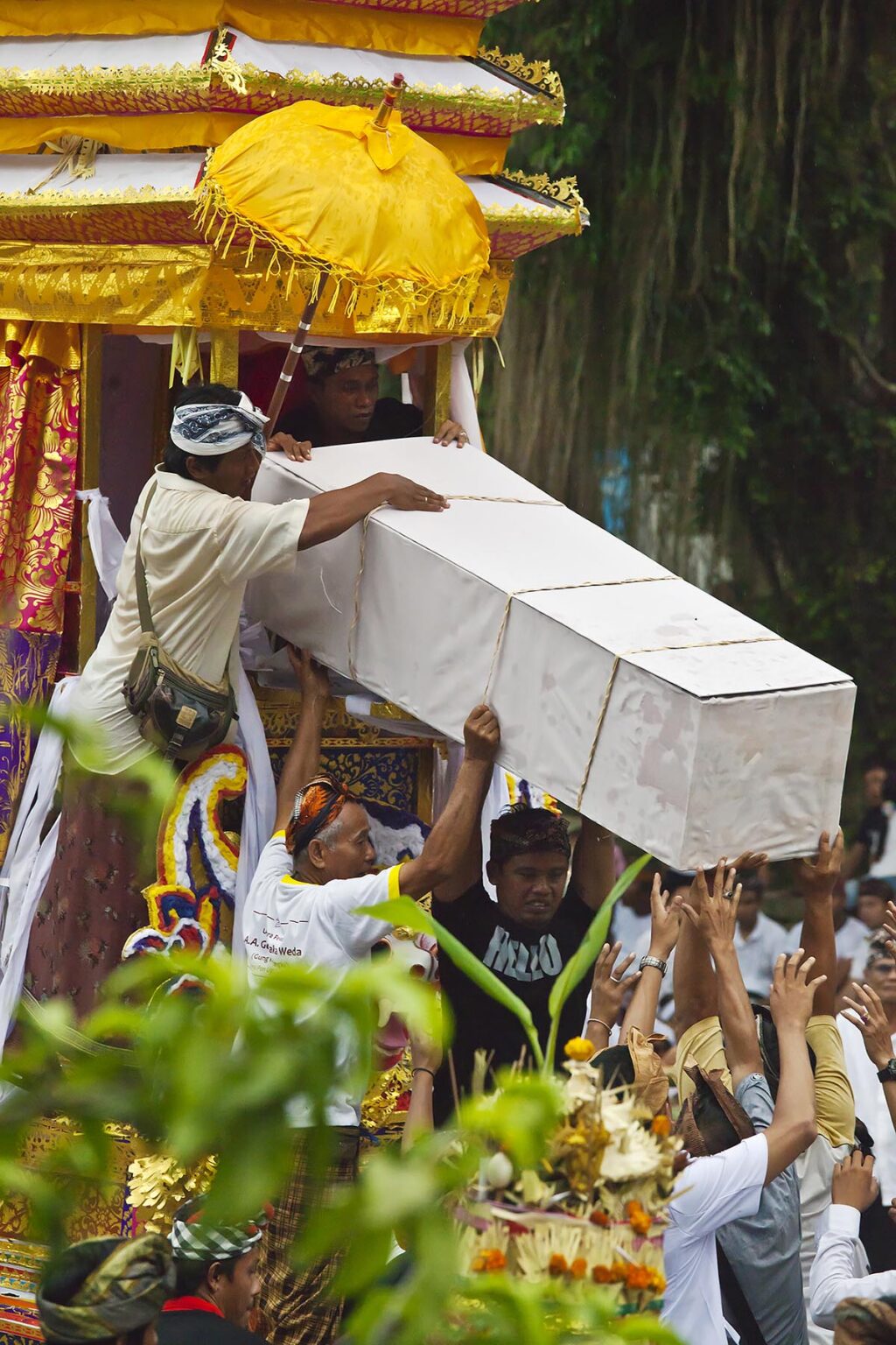 A Hindu style CREMATION PROCESSION where the dead body is transported in a pagoda - UBUD, BALI, INDONESIA