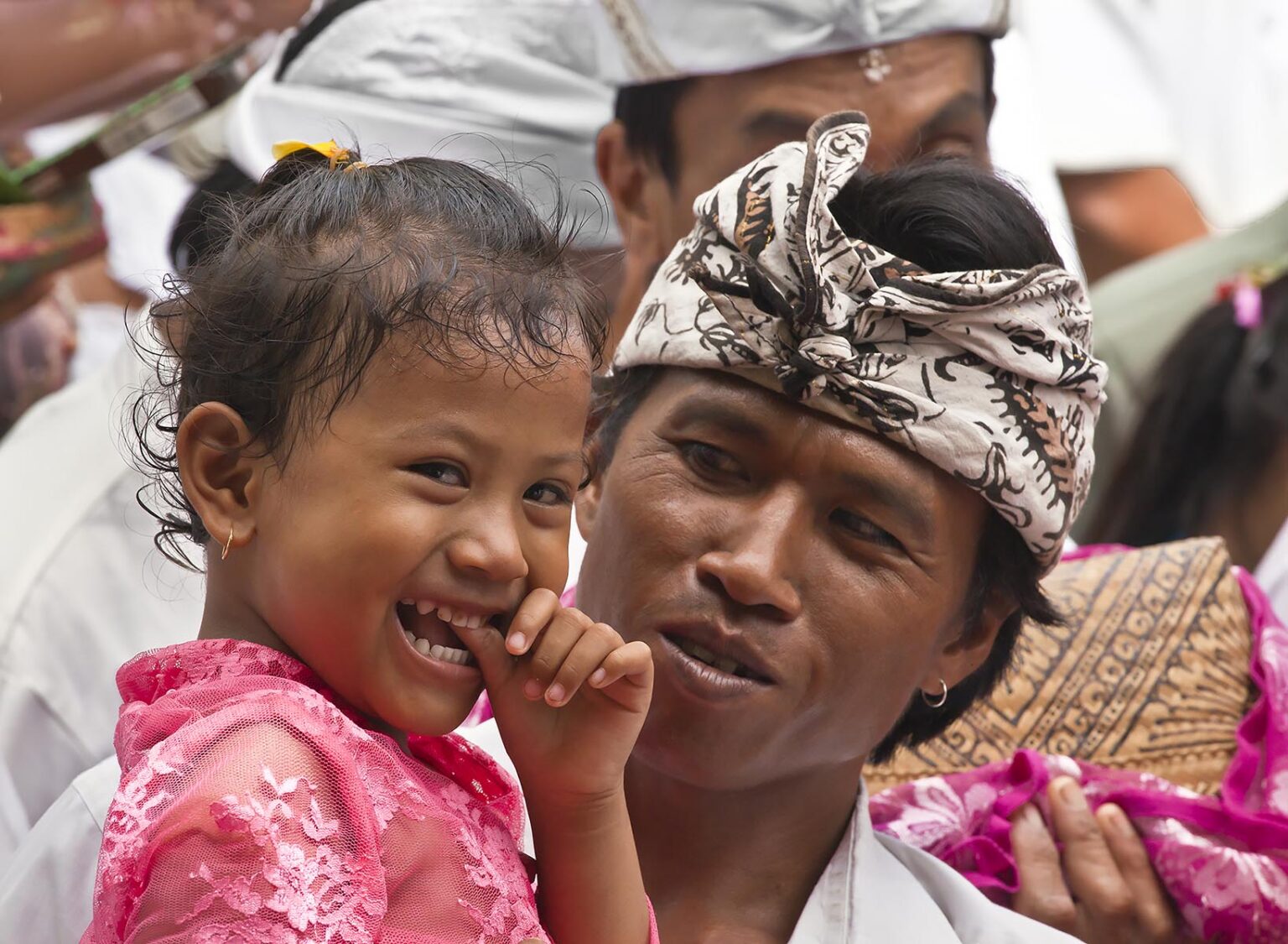 A BALINESE father and daughter at PURA BEJI in the village of Mas during the GALUNGAN FESTIVAL - UBUD, BALI, INDONESIA