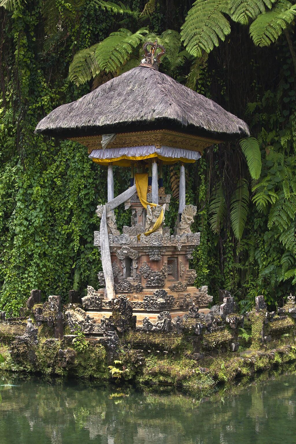Island temple in a pond at PURA GUNUNG KAWI,  a Hindu water temple dedicated to the god of wisdom VISHNU - SEBATU, BALI, INDONESIA