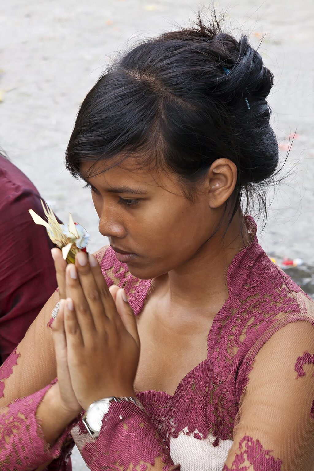 Hindu Women pray at the PURA TIRTA EMPUL TEMPLE COMPLEX during the GALUNGAN FESTIVAL - TAMPAKSIRING, BALI, INDONESIA