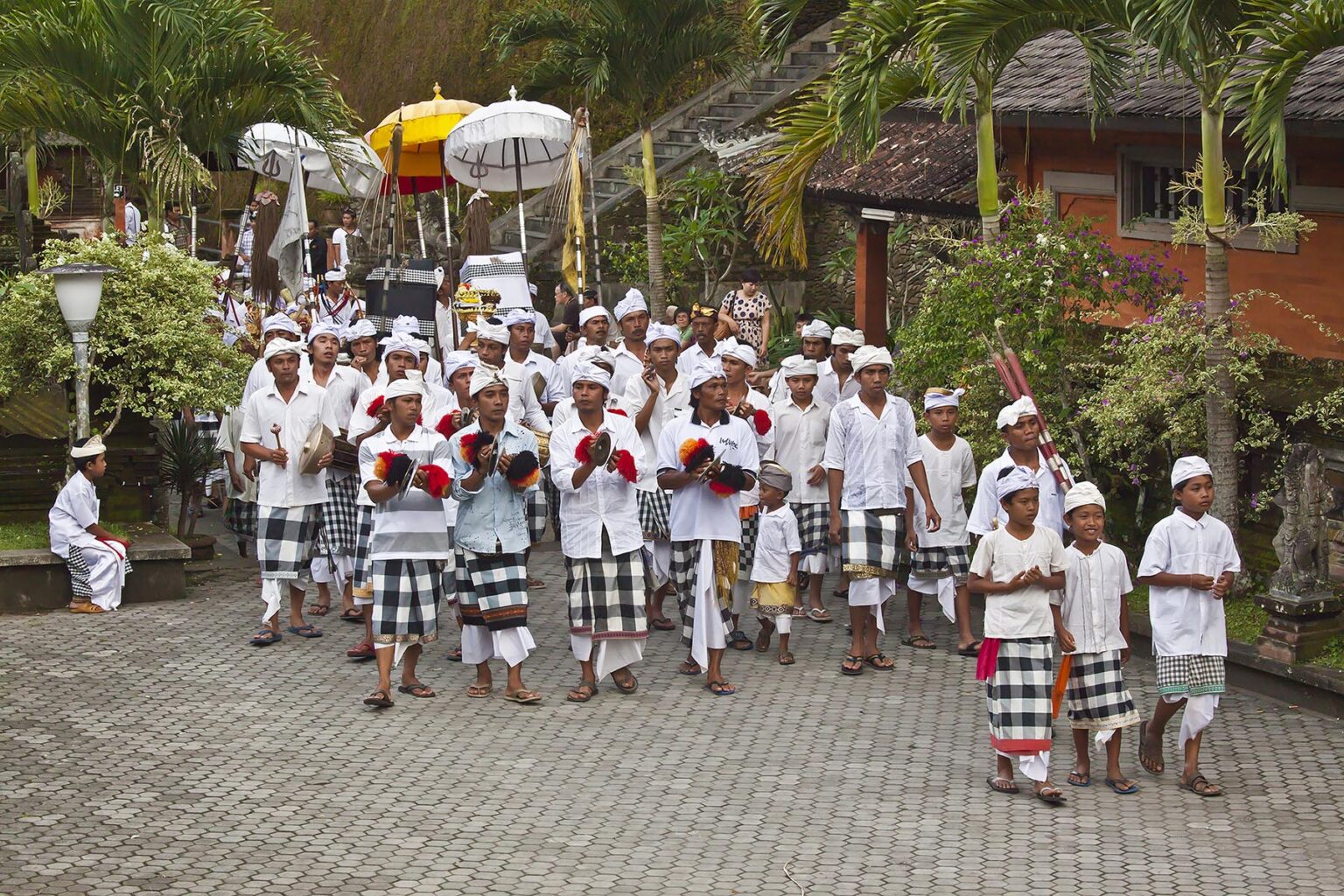 A procession of musicians are part of the ceremony at PURA TIRTA EMPUL TEMPLE COMPLEX during the GALUNGAN FESTIVAL - TAMPAKSIRING, BALI, INDONESIA