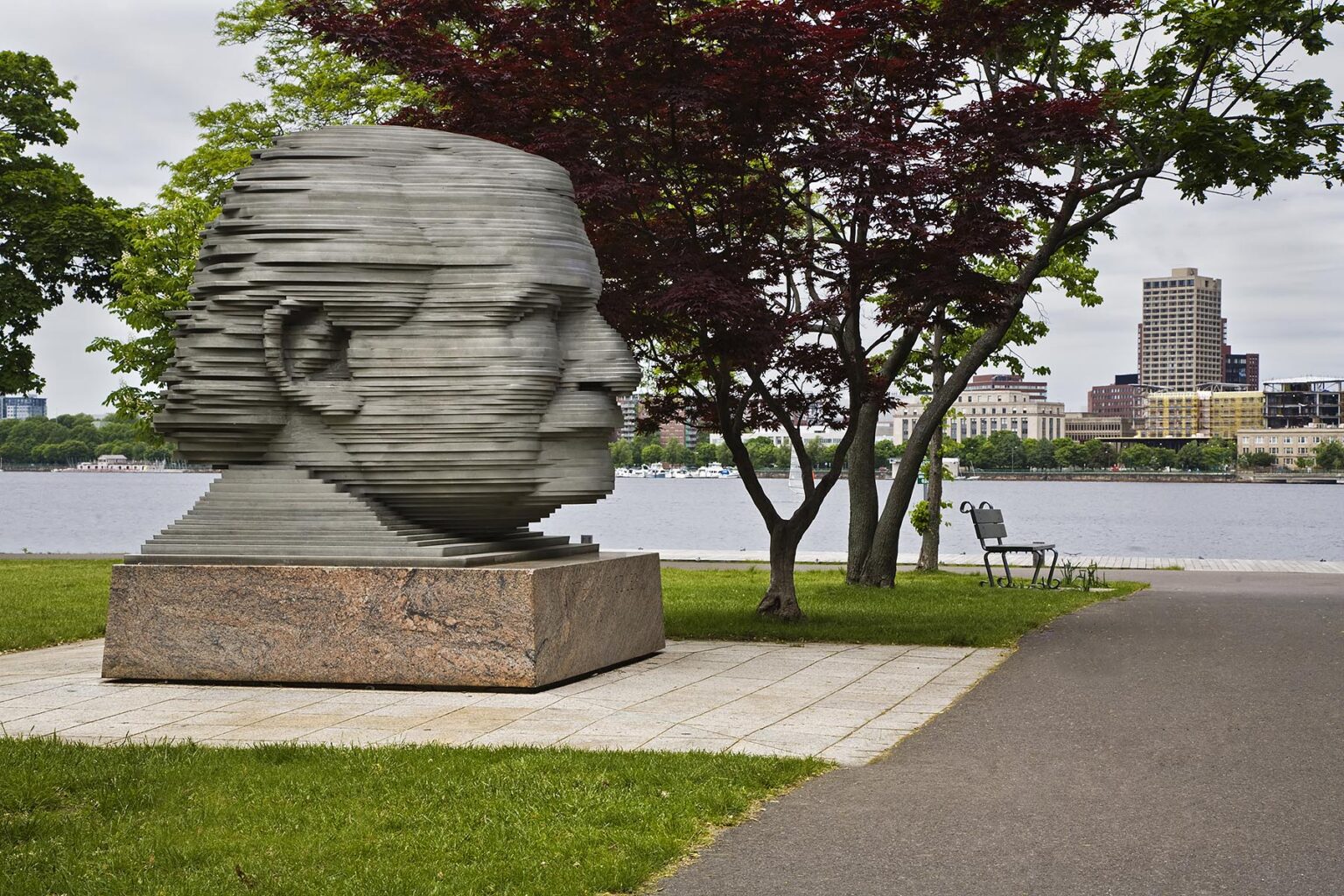A statue of ARTHUR FIEDLER the conductor of the Boston Pops orchestra in CHARLES RIVER PARK - BOSTON, MASSACHUSETTS