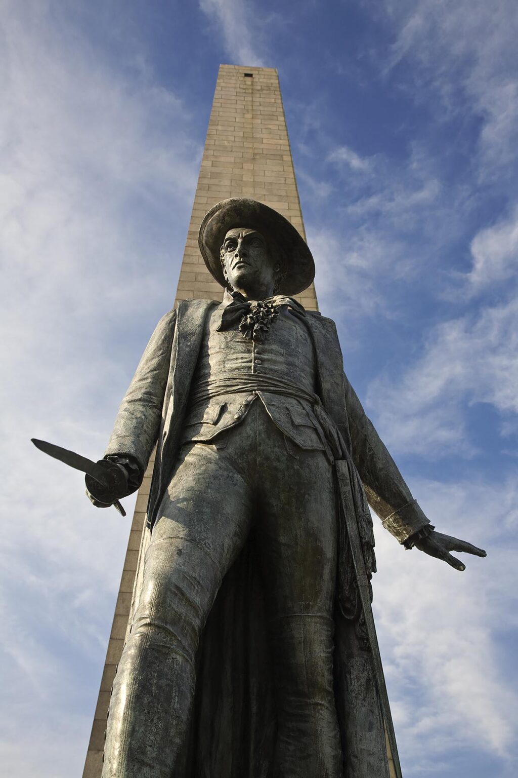 Statue of COLONEL WILLIAM PRESSCOTT and the GRANITE OBELISK at the BUNKER HILL MONUMENT located on Breed's Hill - BOSTON, MASSACHUSETTS