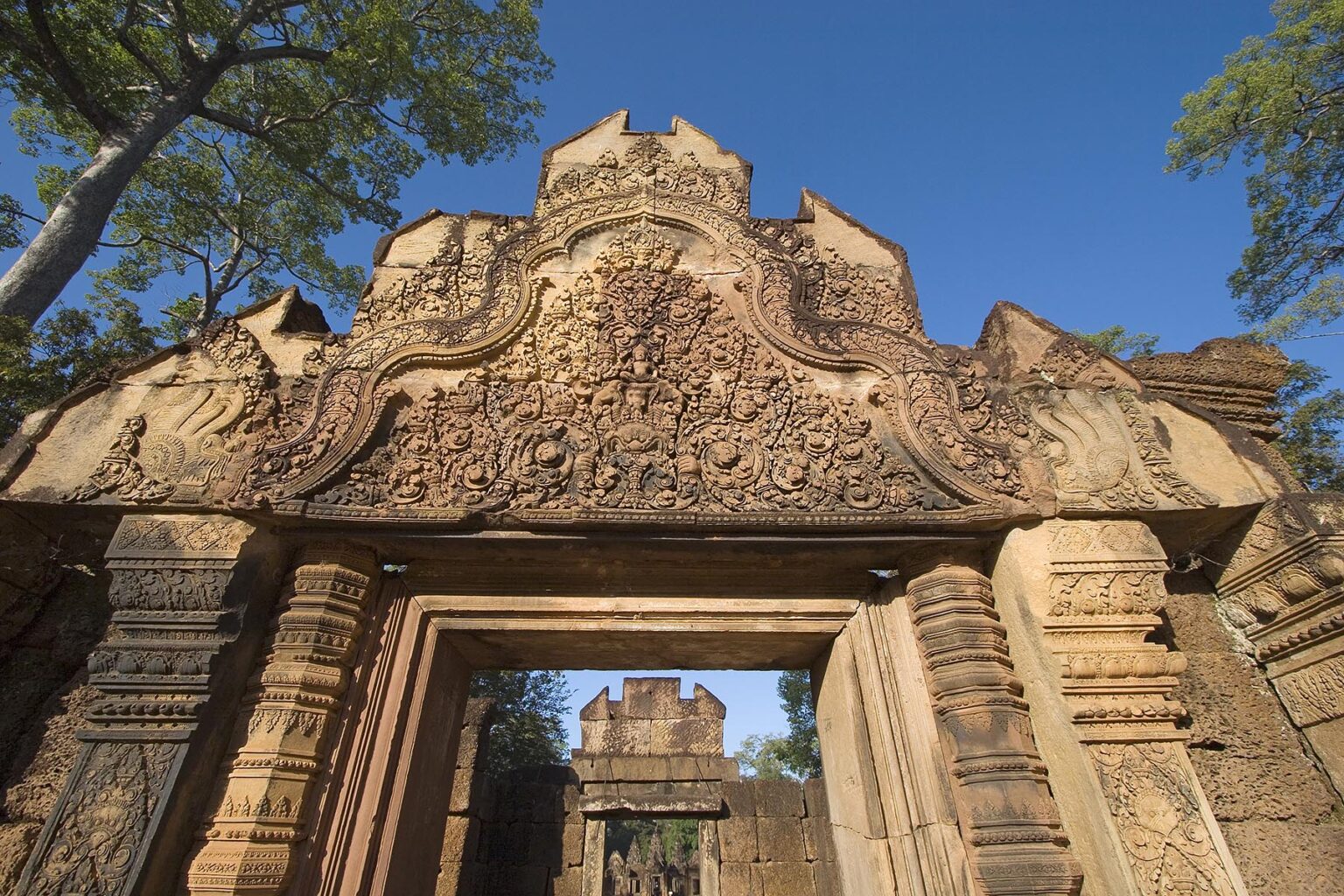 East Gopura of Banteay Srei with bas relief in red sandstone, 10th century Khmer architecture at Angkor Wat - Siem Reap, Cambodia