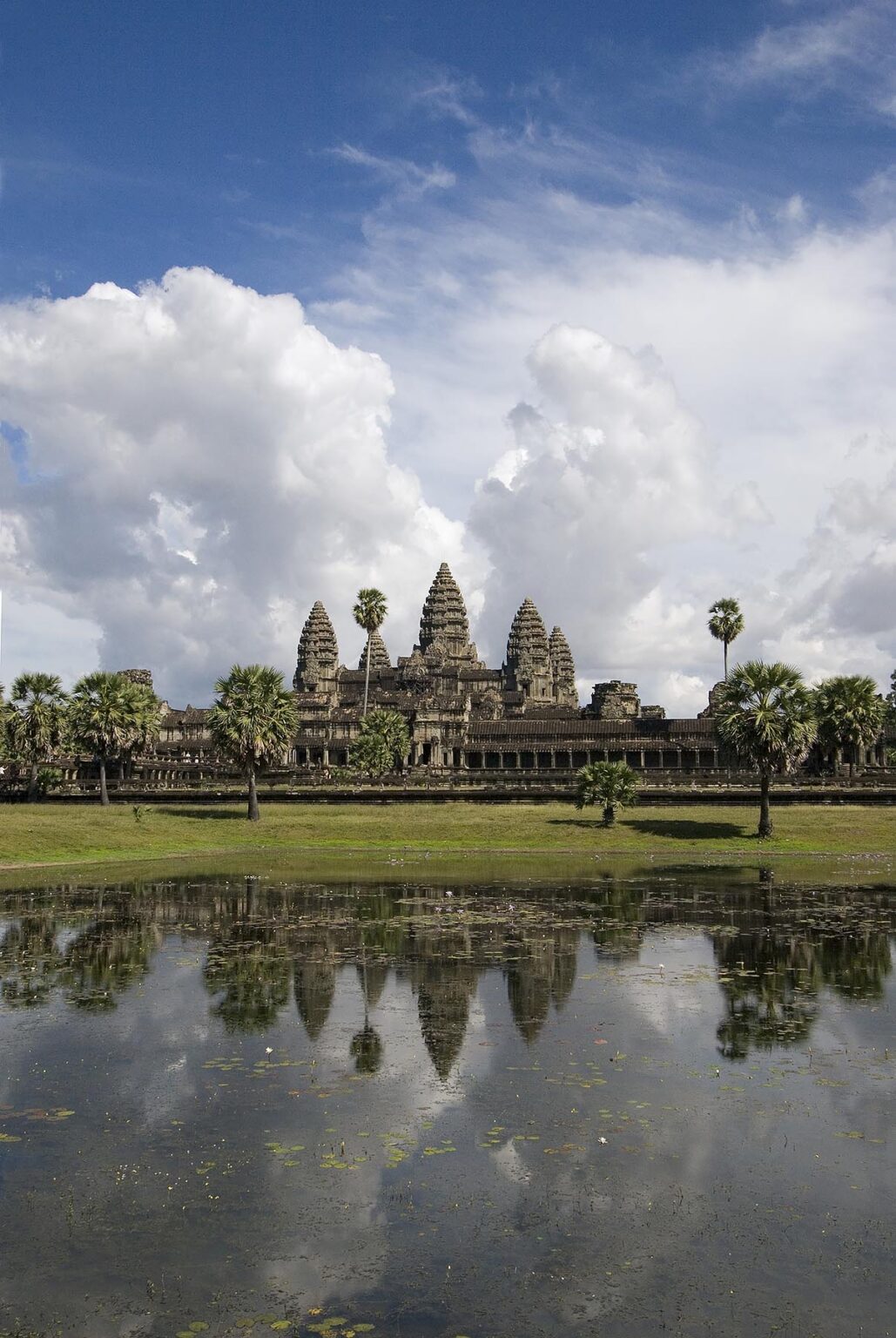 Stone temples representing the five peaks of Mount Meru at Angkor Wat and reflection pond, built in the 11th century by Suryavarman the 2nd,  - Cambodia