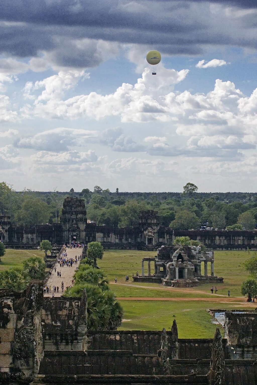Hot air balloon above the West Gopura gate at Angkor Wat, built in the 11th century by Suryavarman the 2nd - Cambodia