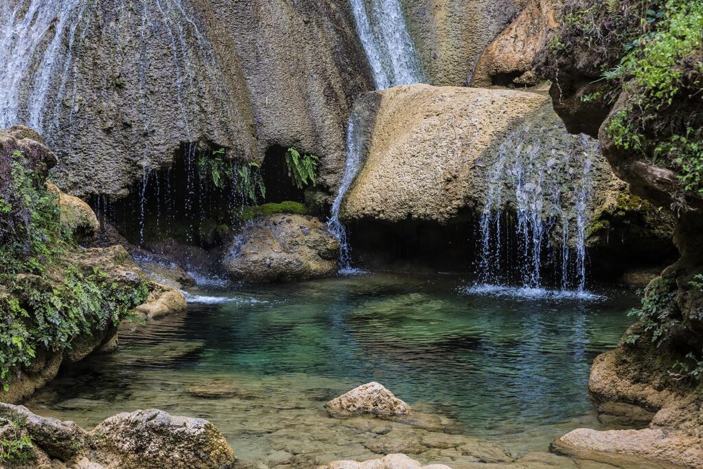A creek in the tropical forest on the hike to EL NICHO WATERFALL in the SIERRA DEL ESCAMBRAY mountains - CIENFUEGOS, CUBA