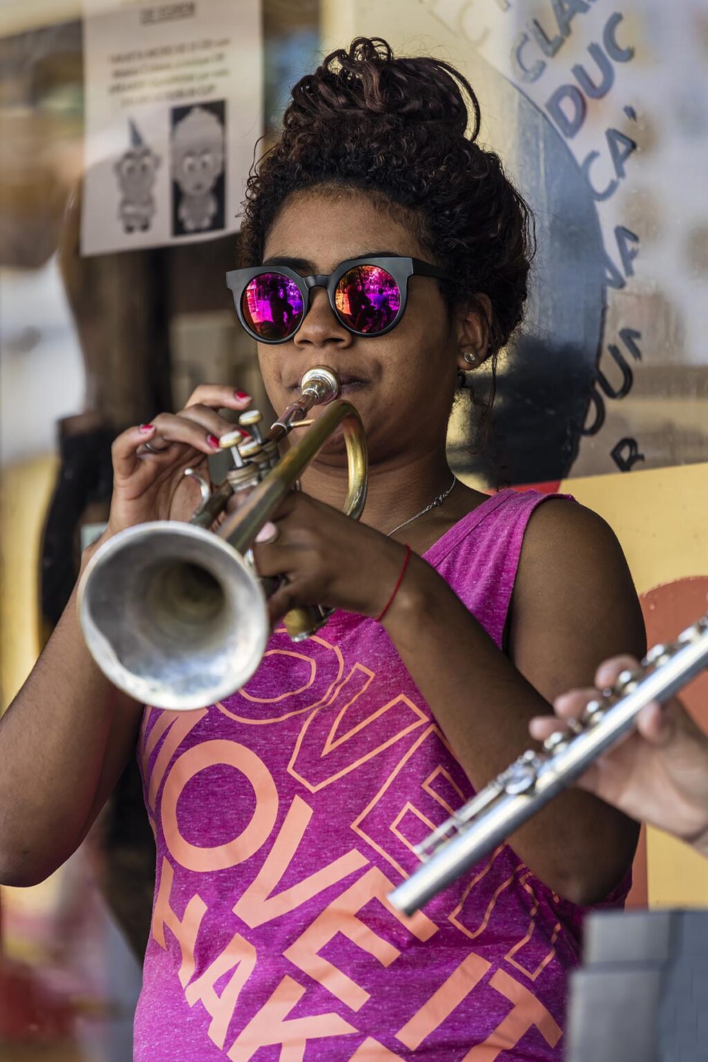 A TRUMPET player entertains tourists with Latin beats in the CASA DE MUSICA - TRINIDAD, CUBA
