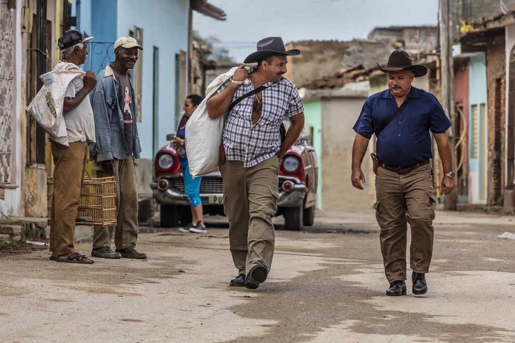 COWBOYS walk through town - TRINIDAD, CUBA