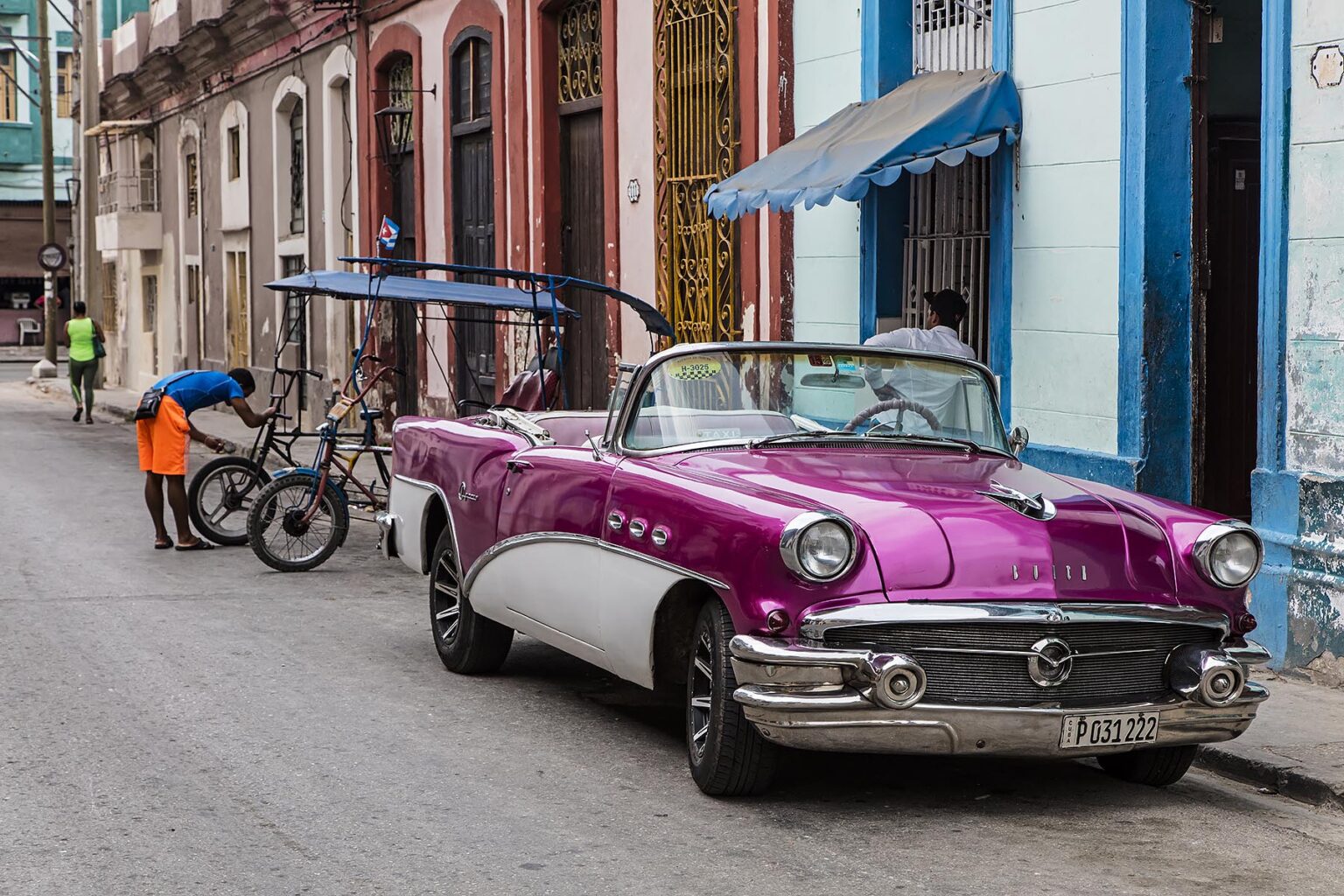 A Classic American cart outside the artist colony CALLEJON DE HAMEL started by SALVADOR GONZALES - HAVANA, CUBA