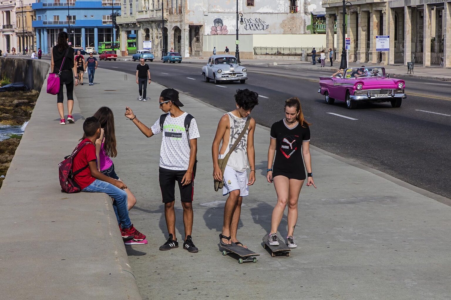Youth on their skate boards along the MALECON - HAVANA, CUBA