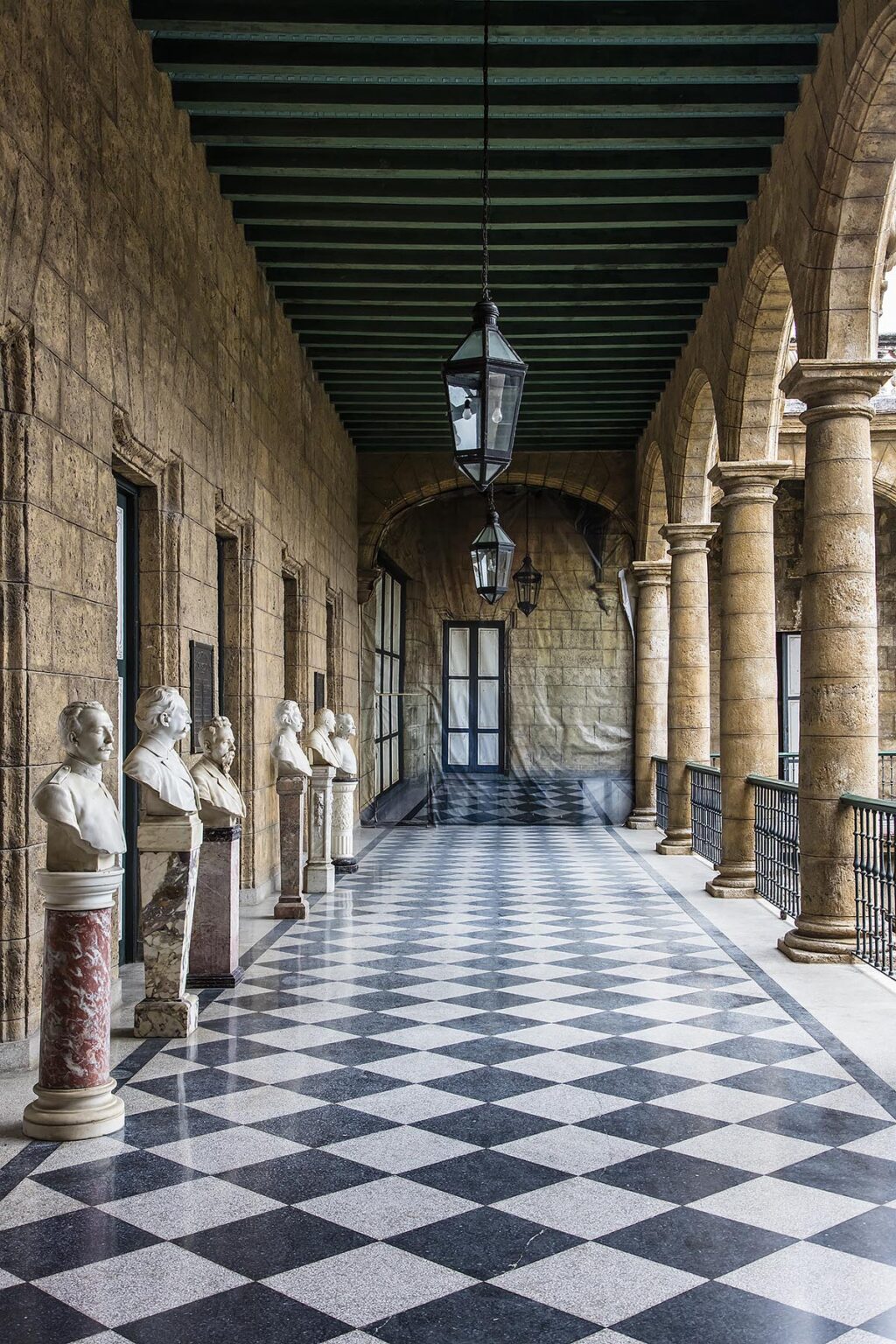 Marble statues line the the courtyard of the MUSEO DE LA CUIDAD - HAVANA, CUBA