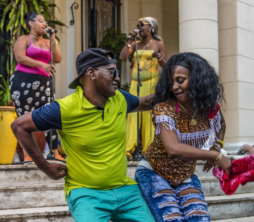 Dancers appreciate the sound of a  RUMBA GROUP playing Afro-Cuban music in VEDADO - HAVANA, CUBA