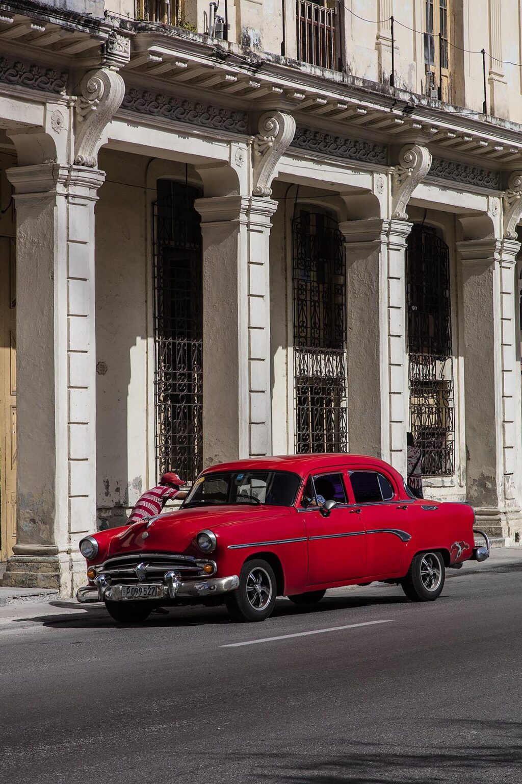 A classic car along the PASEO DE MARTI also known as the PRADO - HAVANA, CUBA
