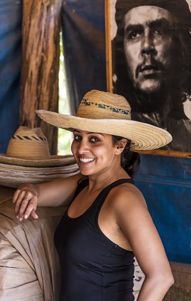 A tourist enjoys a visit to CASA MANOLO, famous for its organic cigars grown in the Vinales Valley - VINALES, CUBA