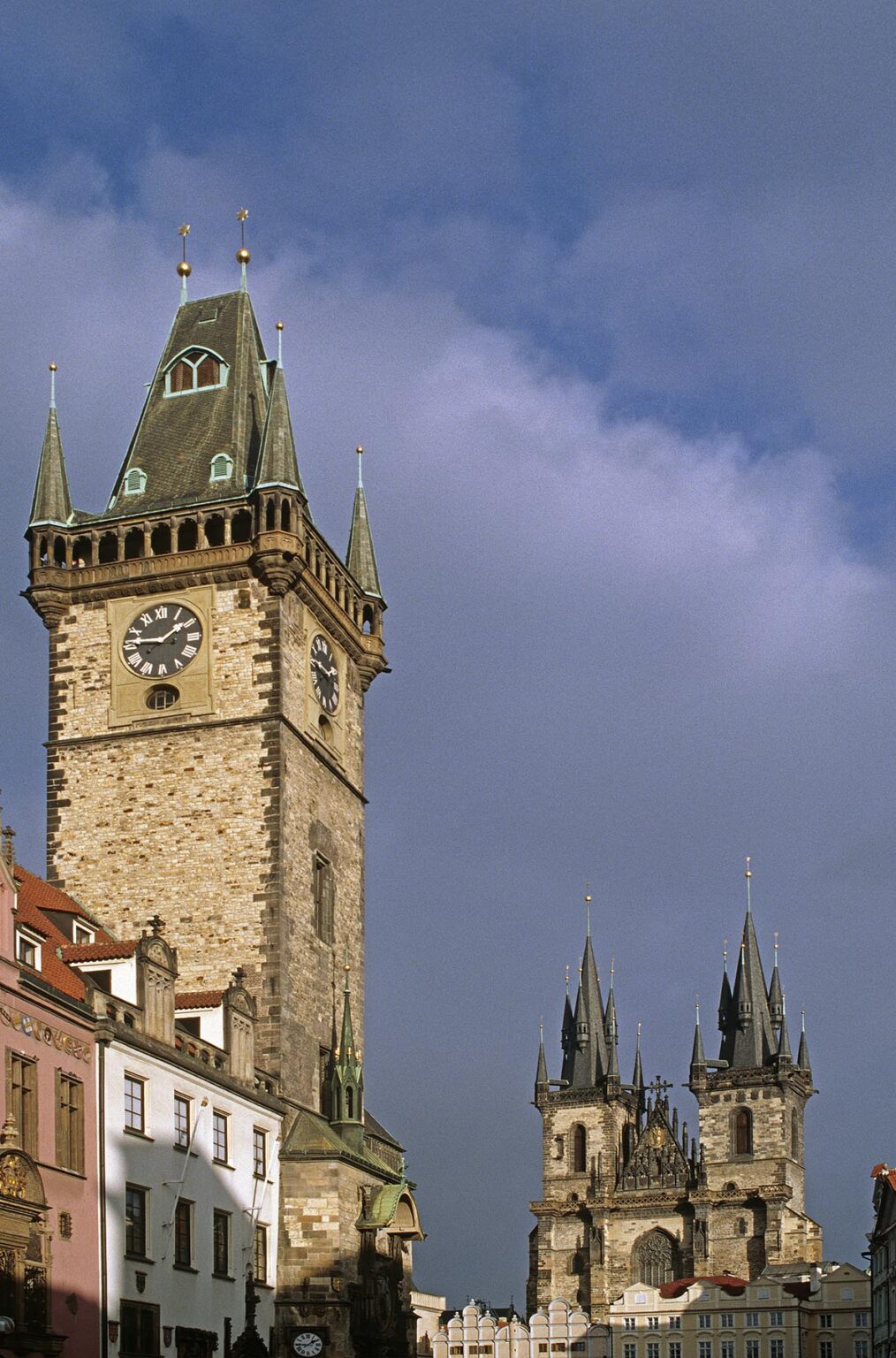 The CLOCK TOWER of OLD TOWN HALL with the GOTHIC TYN CHURCH behind - PRAGUE, CZECH REPUBLIC