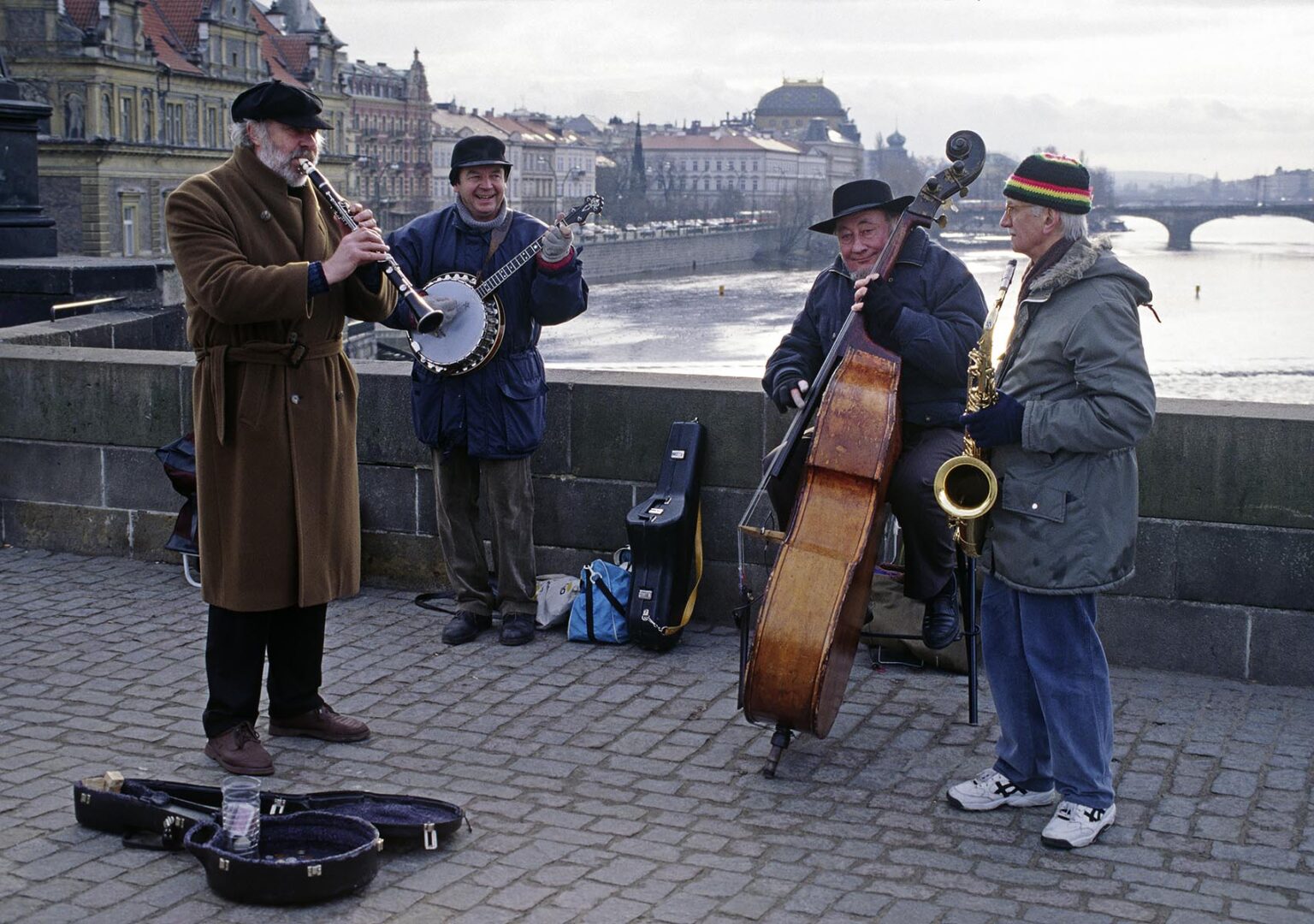 MUSICIANS play for change on the CHARLES BRIDGE (KARLUV MOST) built in 1357 by CARLO the 4th - PRAGUE, CZECH REPUBLIC
