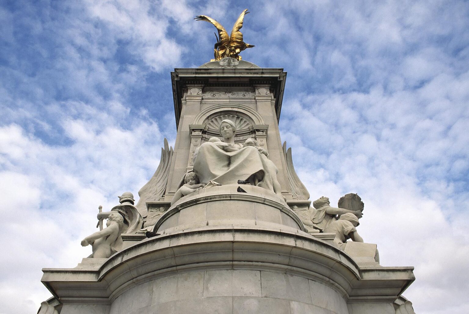 QUEEN VICTORIA MEMORIAL sits in front of BUCKINGHAM PALACE - LONDON, ENGLAND