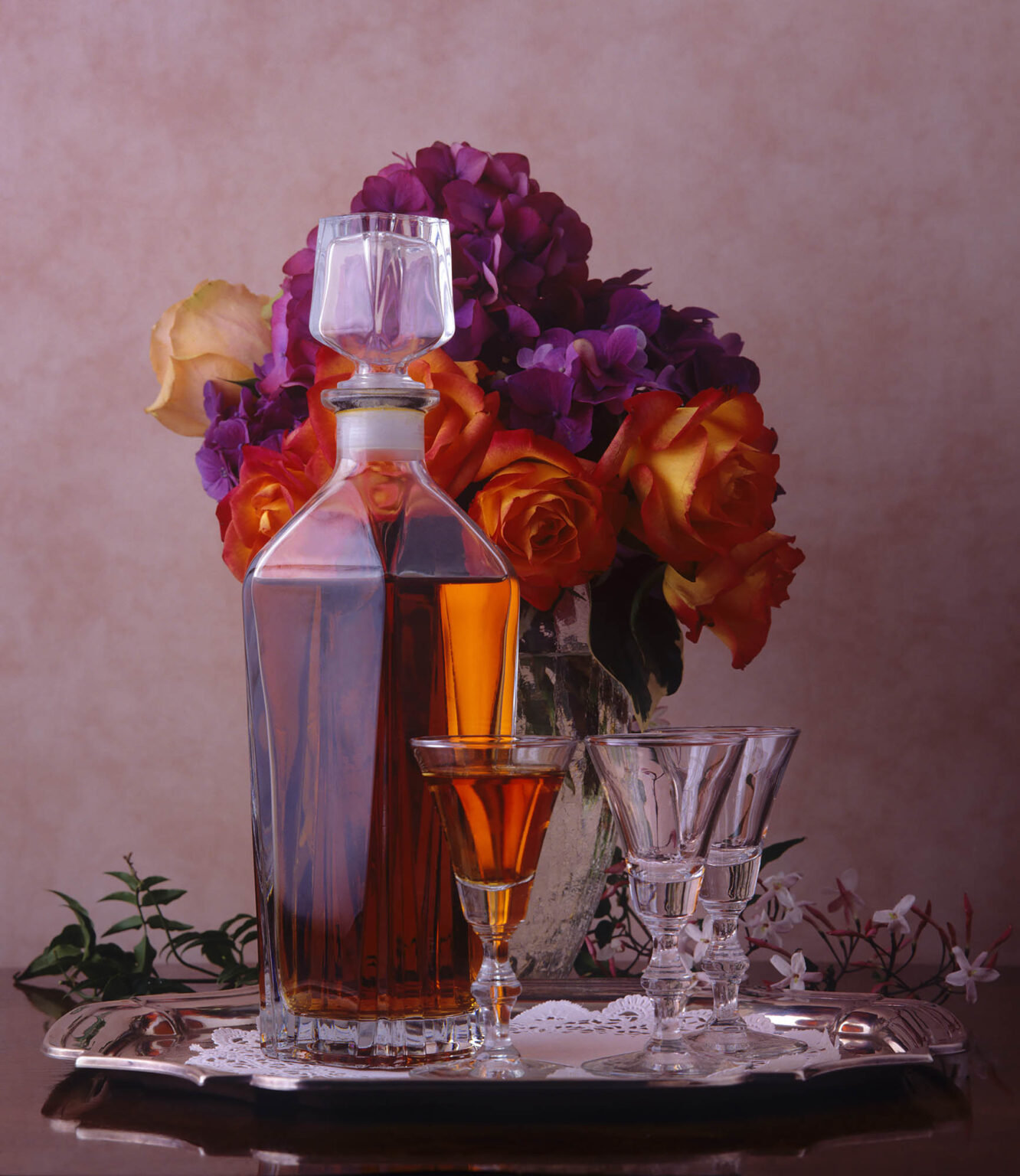A GLASS DECANTER full of BRANDY with CRYSTAL GLASSES