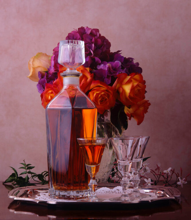 A GLASS DECANTER full of BRANDY with CRYSTAL GLASSES.  Still-life photography by Craig Lovell.