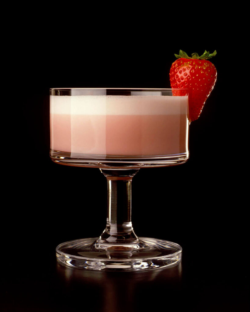 A strawberry daiquiri in a crystal glass.  Food photography by Craig Lovell