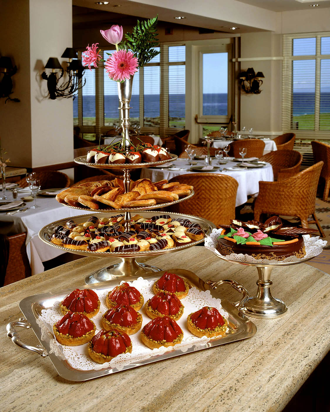 Deserts at a Spanish Bay restaurant displaying chocolate covered strawberries, chocolate cake, strawberry tarts and cookies.  Food photography by Craig Lovell.