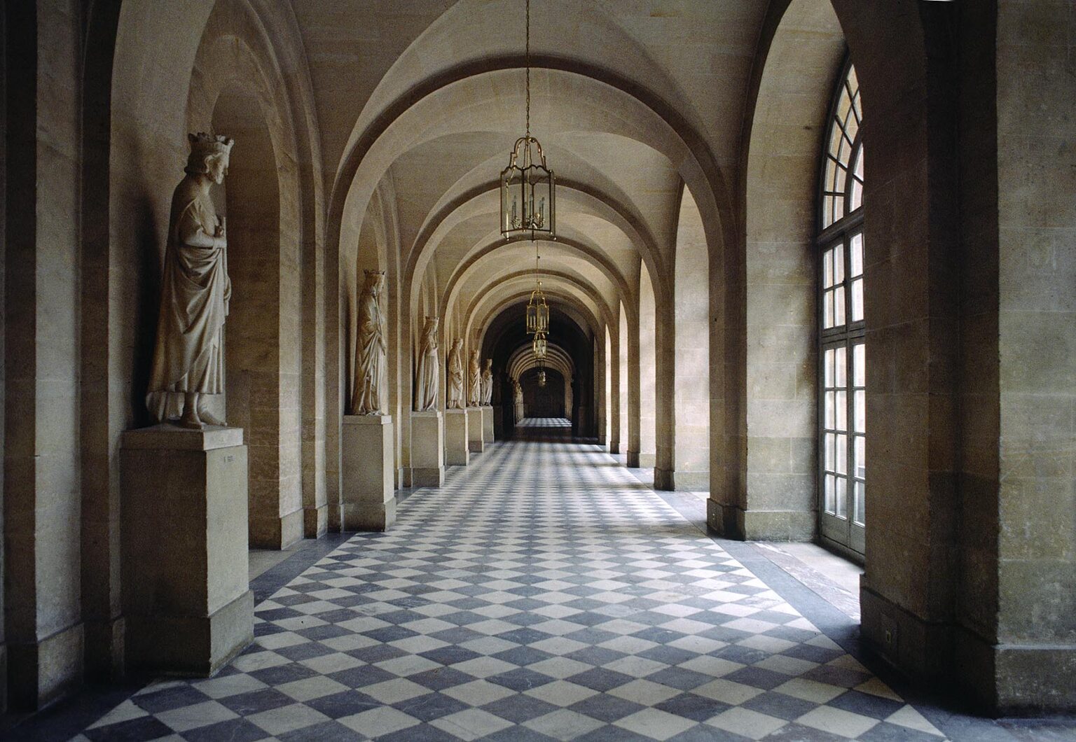 STATUES of FRENCH MONARCHS and MARBLE HALLWAY in the PALACE OF VERSAILLES, pleasure home of LOUIS XIV - VERSAILLES, FRANCE