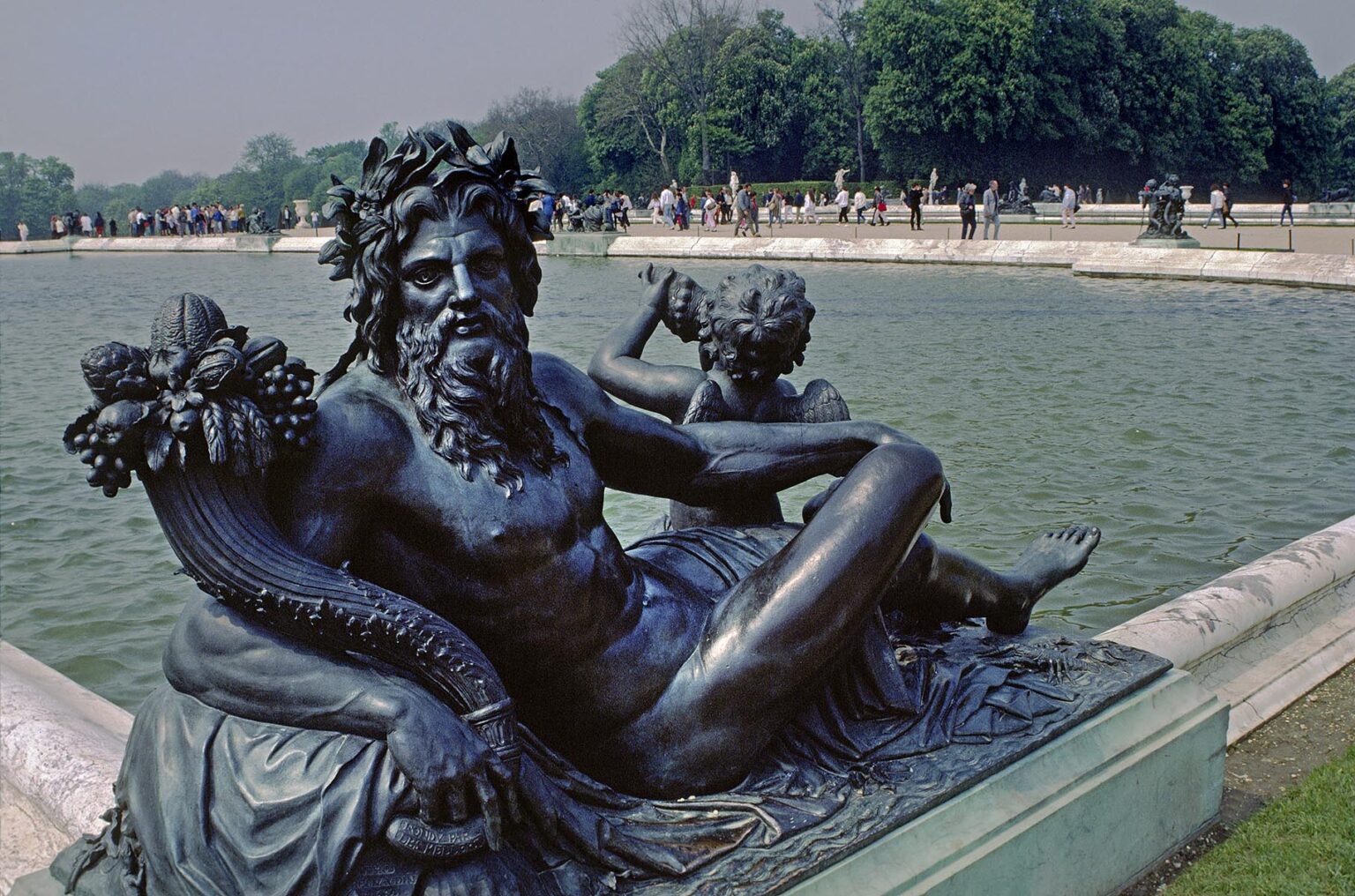 BRONZE STATUE of BACCHUS with CHERUB and a FOUNTAIN of VERSAILLES PALACE, built for LOUIS XIV, the SUN KING - VERSAILLES, FRANCE