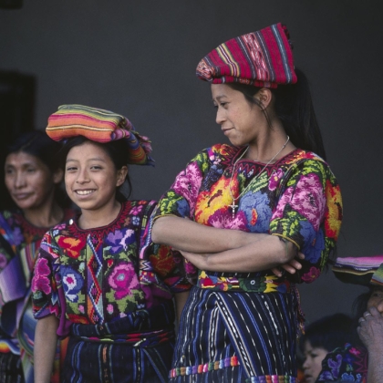 GUATEMALAN WOMEN of MAYA descent wearing traditional brocade HUIPILS - CHICHICASTENANGO, GAUTEMALA