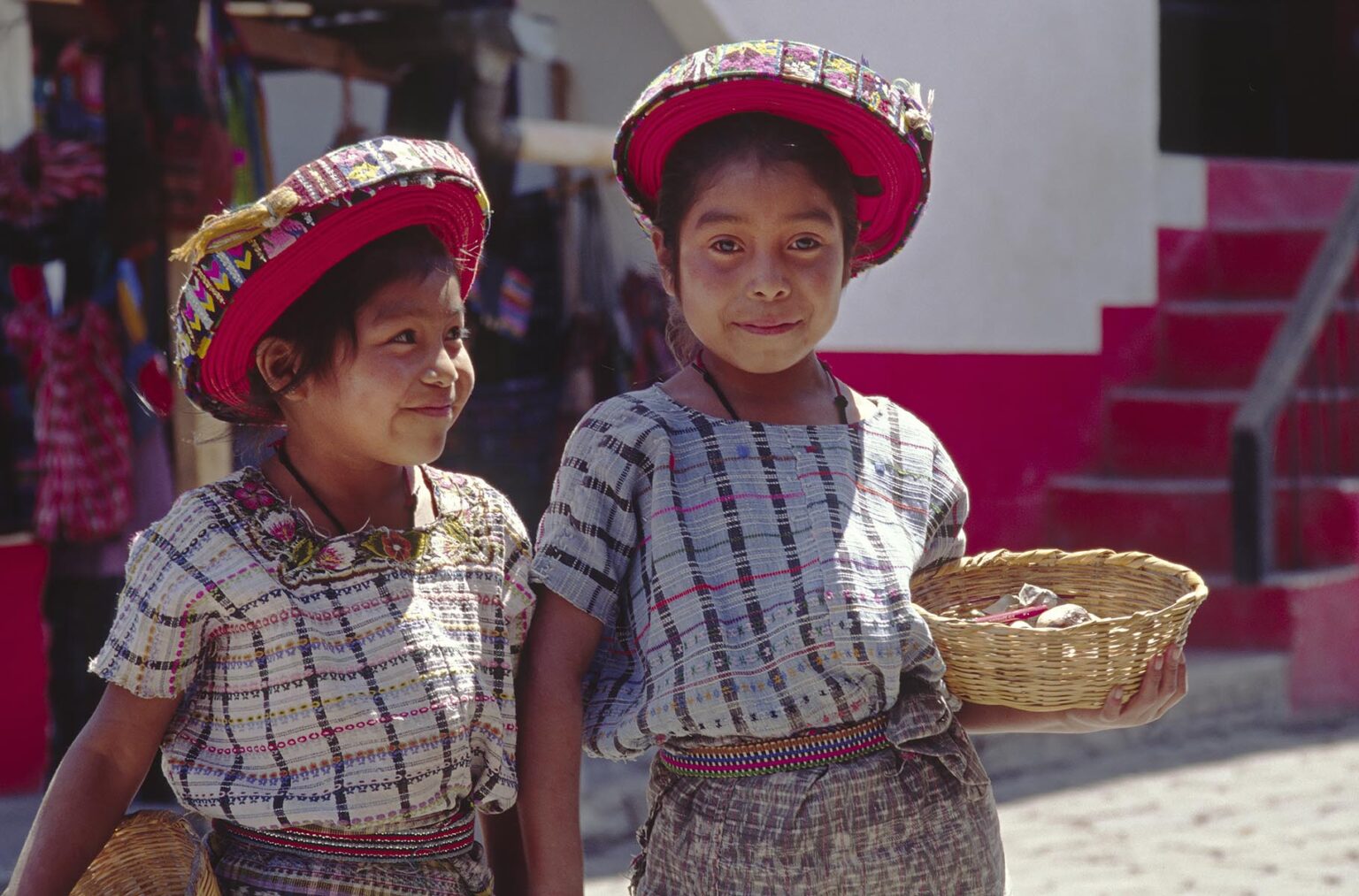 TZUTUJIL GIRLS in traditional handmade HUIPILS (blouses) and TOCAYALS (headresses) - SANTIAGO ATITLAN, GUATEMALA