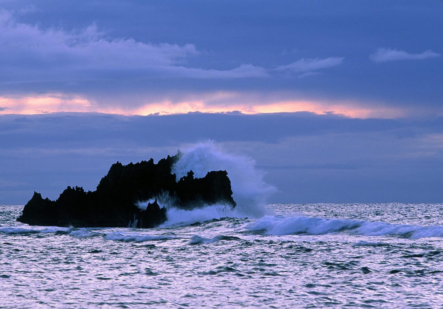 CARIBBEAN SEA SURF breaking over ROCK OUTCROPPING in WEST END BAY - BAY ISLANDS, ROATAN, HONDURAS