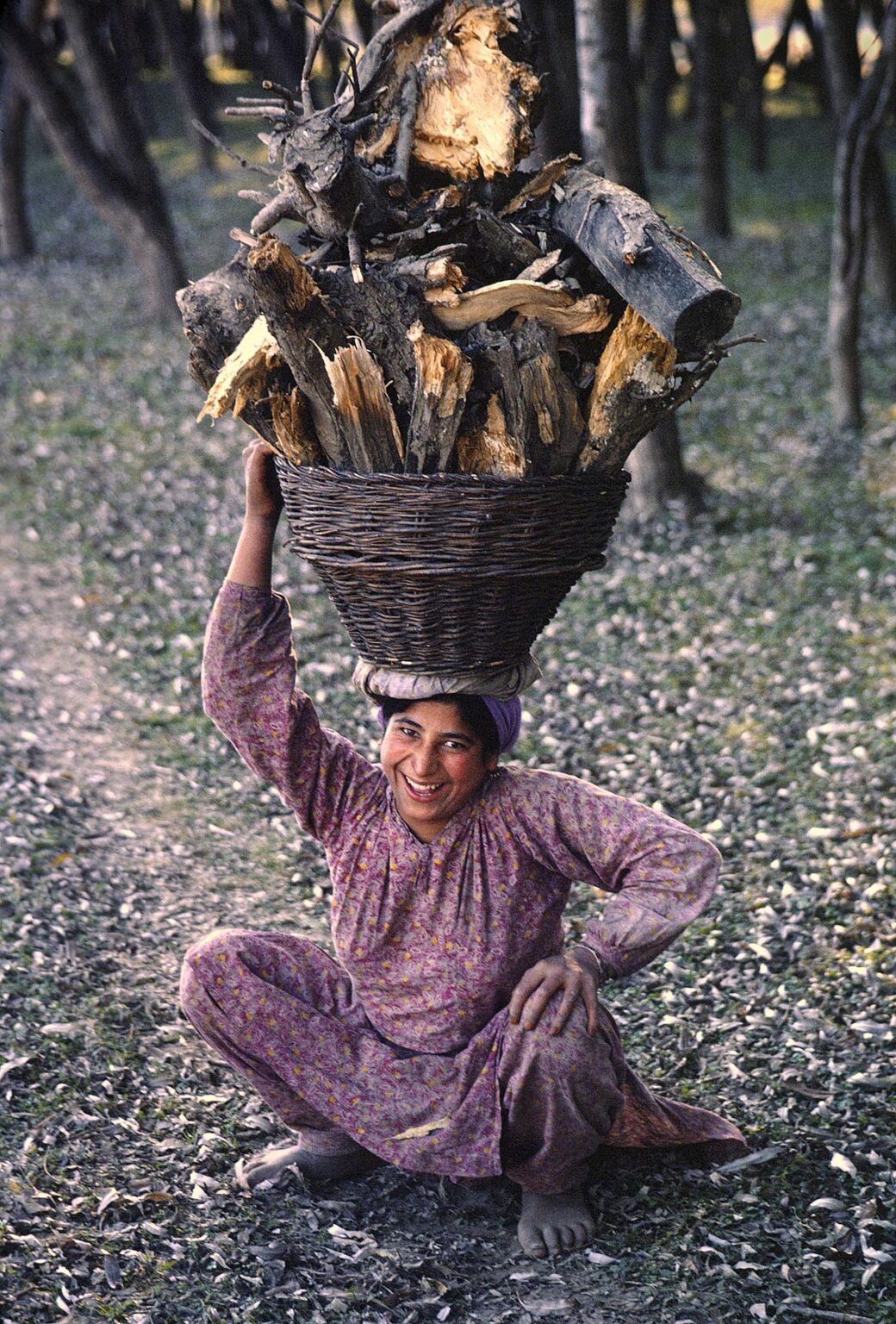 KASHMIRI WOMAN carries a BASKET of FIRE WOOD on her head - KASHMIR, INDIA