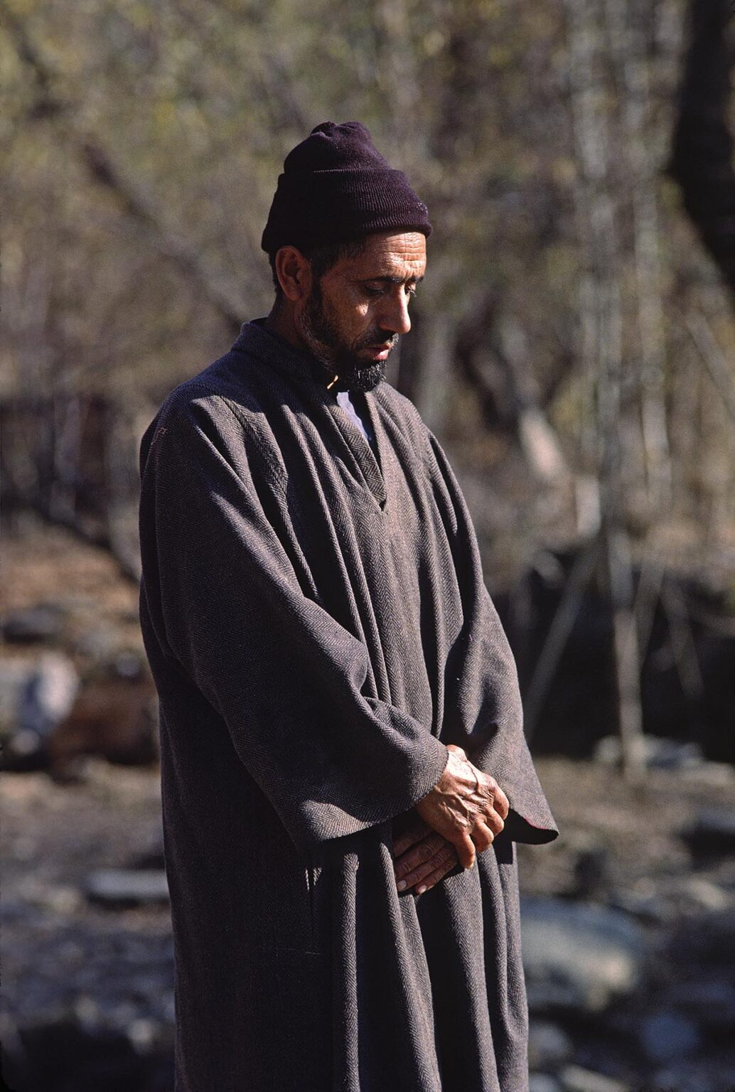 Muslim Kashmiri MAN PRAYS toward Mecca in AFAN VILLAGE in the HIMALAYAN FOOTHILLS - KASHMIR, INDIA