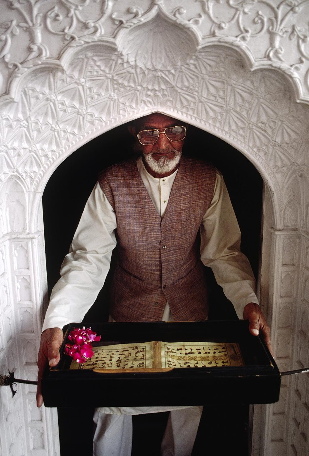 A Muslim CLERIC displays MOHAMMED'S SCRIPTURES at the JAMA MASJID MOSQUE - DELHI, INDIA