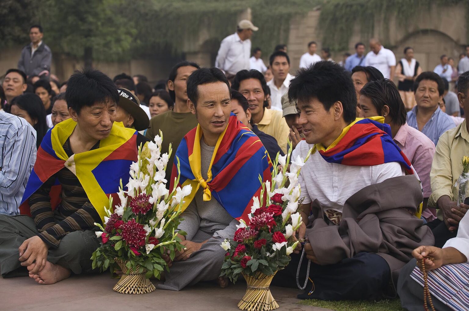 Tibetan Buddhists attend a PRAYER FOR WORLD PEACE sponsored by the14th Dalai Lama of Tibet at the RAJ GHAT (Ghandi's eternal flame) in April of 2008 -  NEW DELHI, INDIA