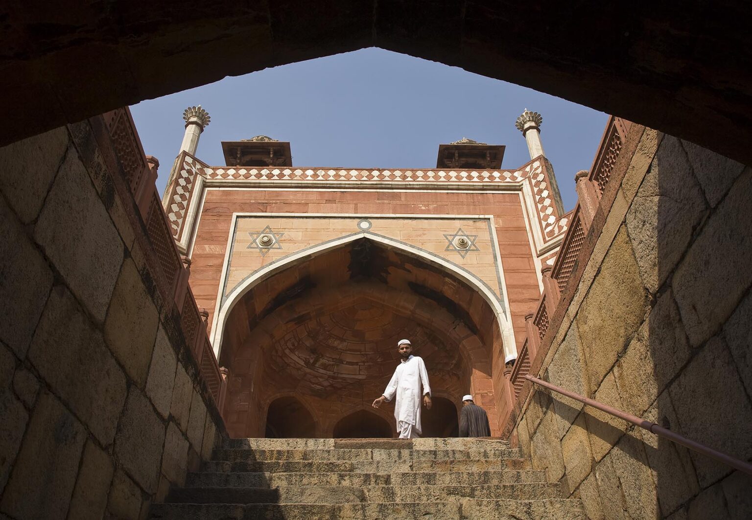 MUSLIM MAN at HUMAYUN'S TOMB which was built of white marble and red sandstone in1565 and is a fine example of MUGHAL architecture - NEW DELHI, INDIA
