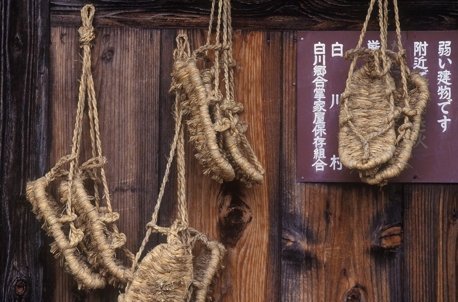 ZORI SANDALS hang on the wall of a RYOKAN in the MOUNTAIN VILLAGE of OGAMACHI, JAPAN