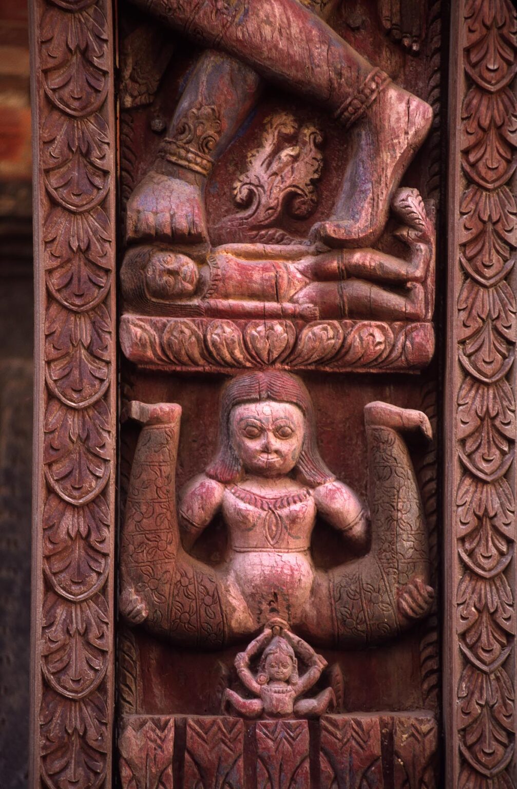 TANTRIC CARVINGS showing birth on ancient temple struts - BHAKTAPUR, NEPAL
