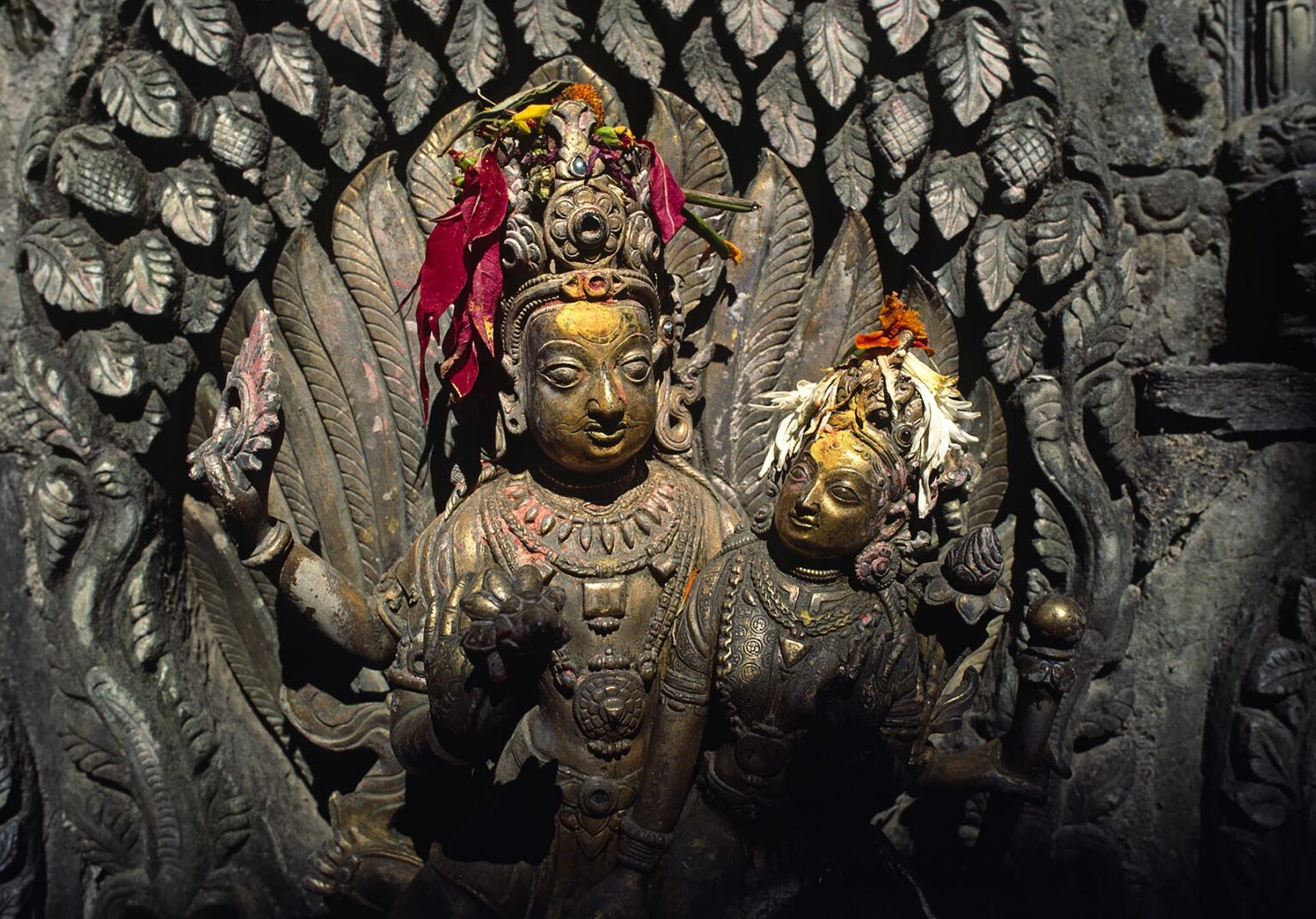 A bronze statue of Shiva & Parvati at the Tusha Hiti or sunken royal bath created around 1670 - Pattan Royal Palace