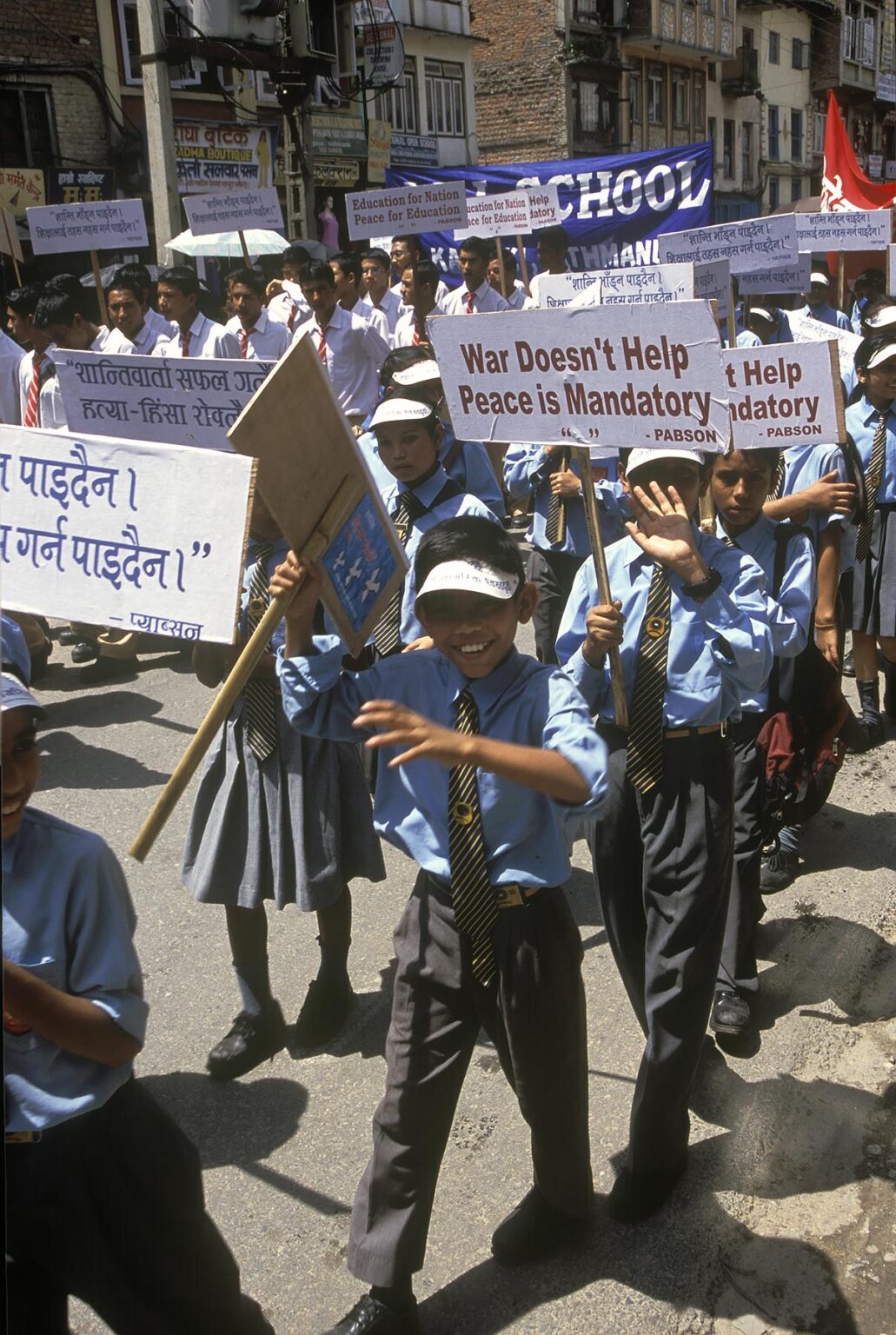 School children march in large PEACE RALLY protesting the violence caused by the MAOIST REBELLION - KATHAMANDU, NEPAL