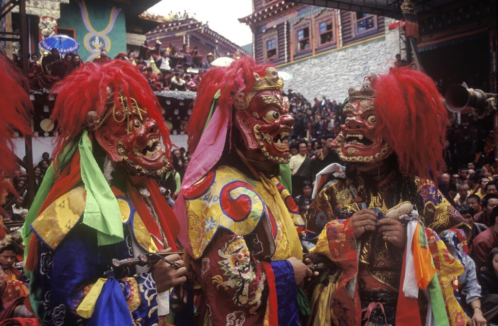 Masked dancers (protector deity) at the Monlam Chenmo or Cham Dances, Katok Monastery - Kham, (Tibet), Sichuan, China
