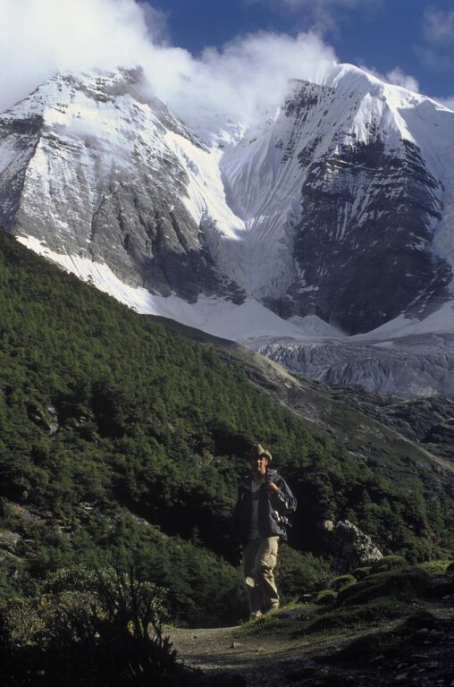 Hiker and Mount Chakna Dorje (5958 M), Nyinteng (Yading) Nature Reserve, Kham - Sichuan Province, China, (Tibet)