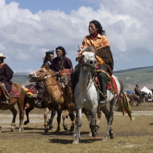 Khampas, the warrior horseman of old Tibet, compete at the Litang Horse Festival - Kham, Sichuan Province, China, (Tibet)