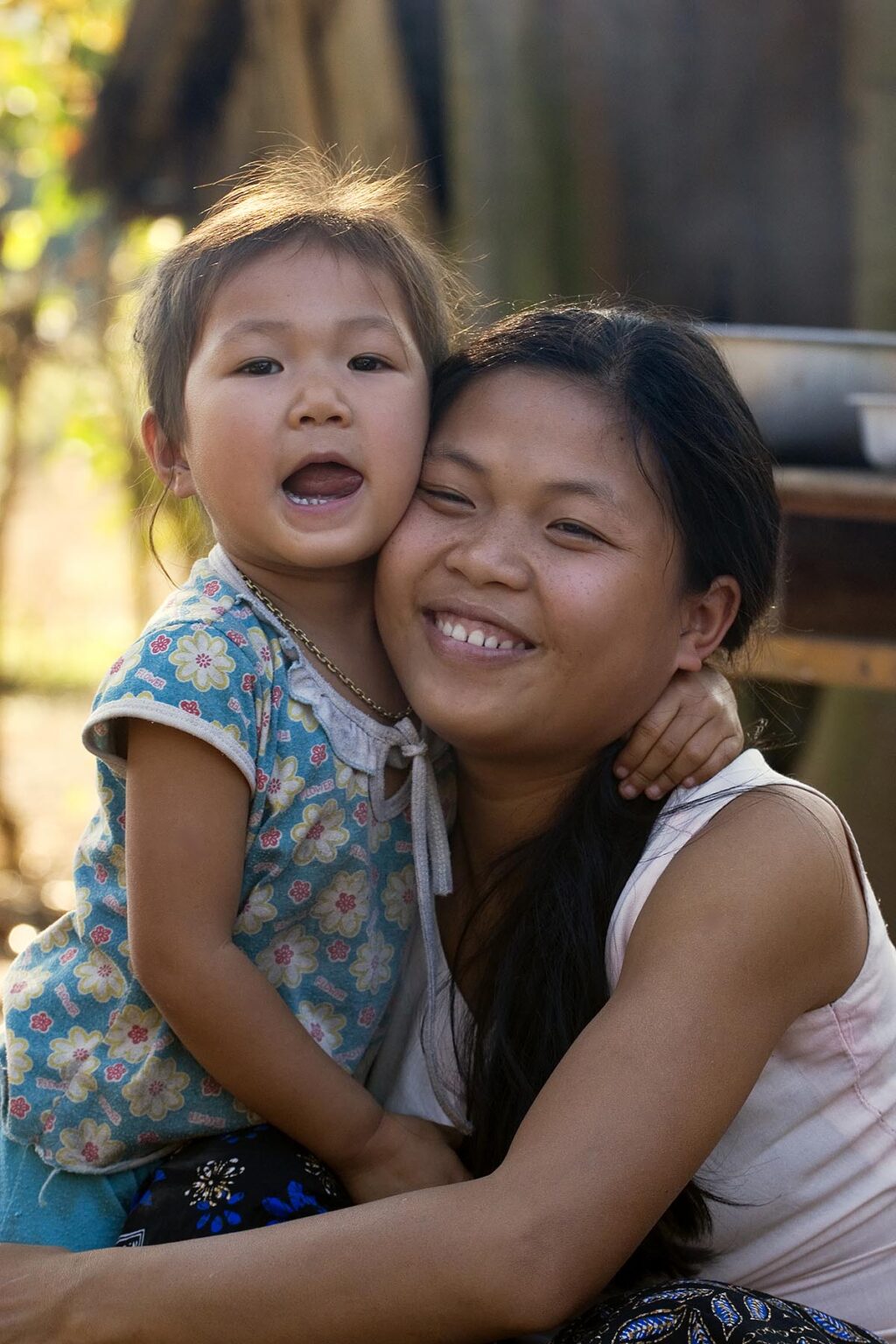 Young village mother and daughter near LUANG PROBANG - LAOS