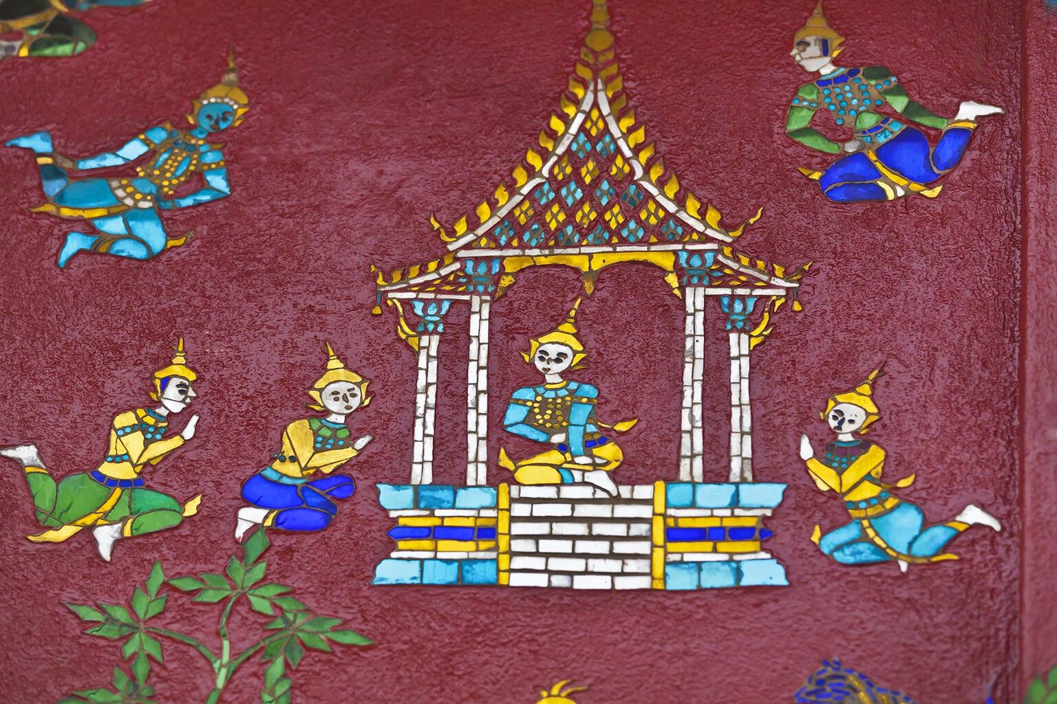 GLASS MOSAIC of deities at the Buddhist WAT XIENG THONG complex (Temple of the Golden City), built in 1560 - LUANG PRABANG, LAOS