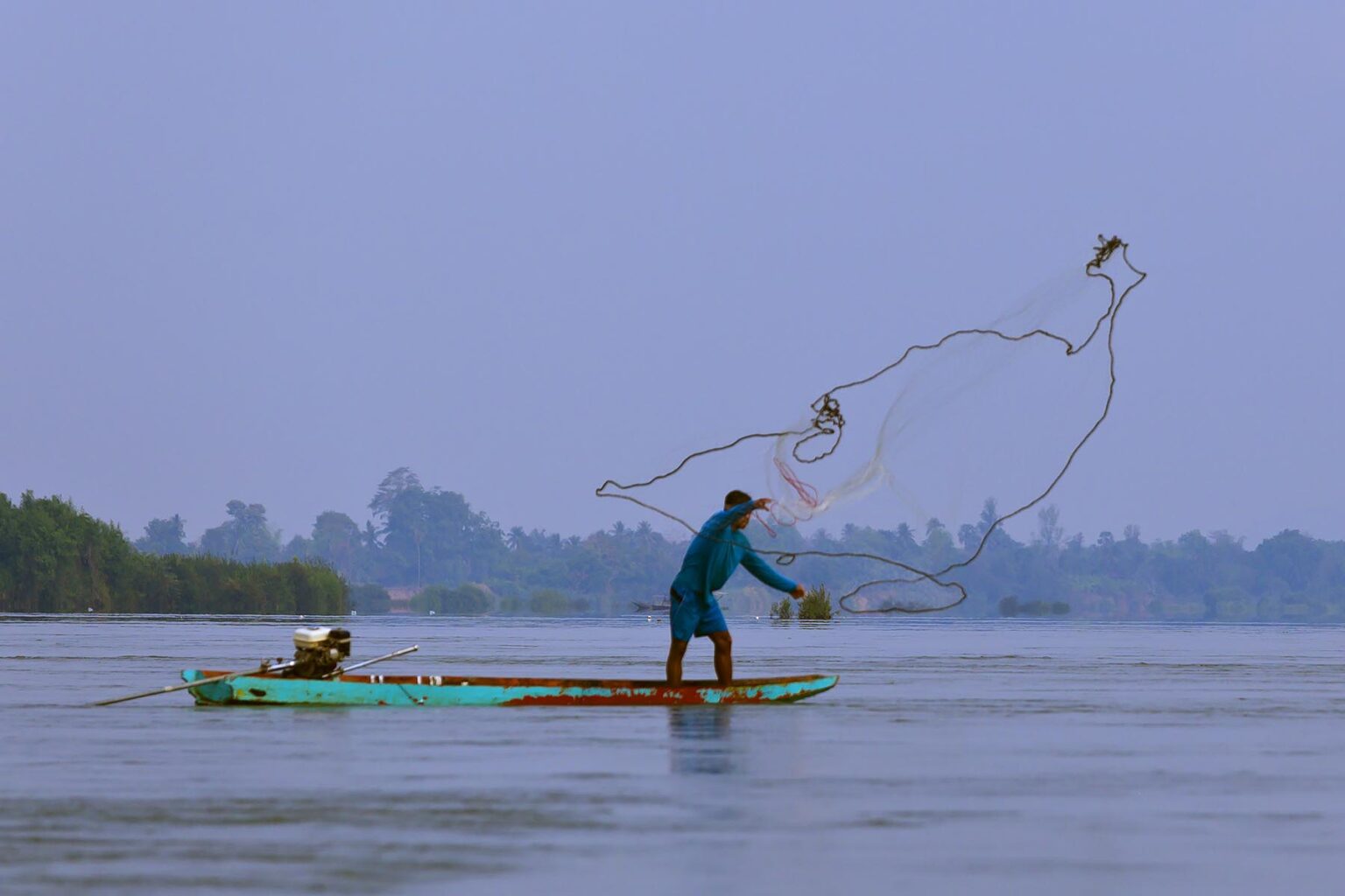 FISHERMAN near the shore of DON KHONG ISLAND in the 10 Thousand Islands area on the Mekong River - SOUTHERN, LAOS